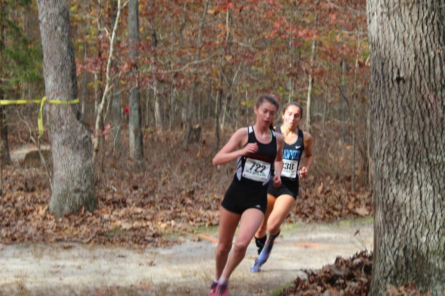 Alexis Mullarkey races at the Group IV Sectional meet at Delsea Regional High School. Teammate Lauren Krott and Lexi finished 2nd and 3rd to give the team another South Jersey Group IV Title.