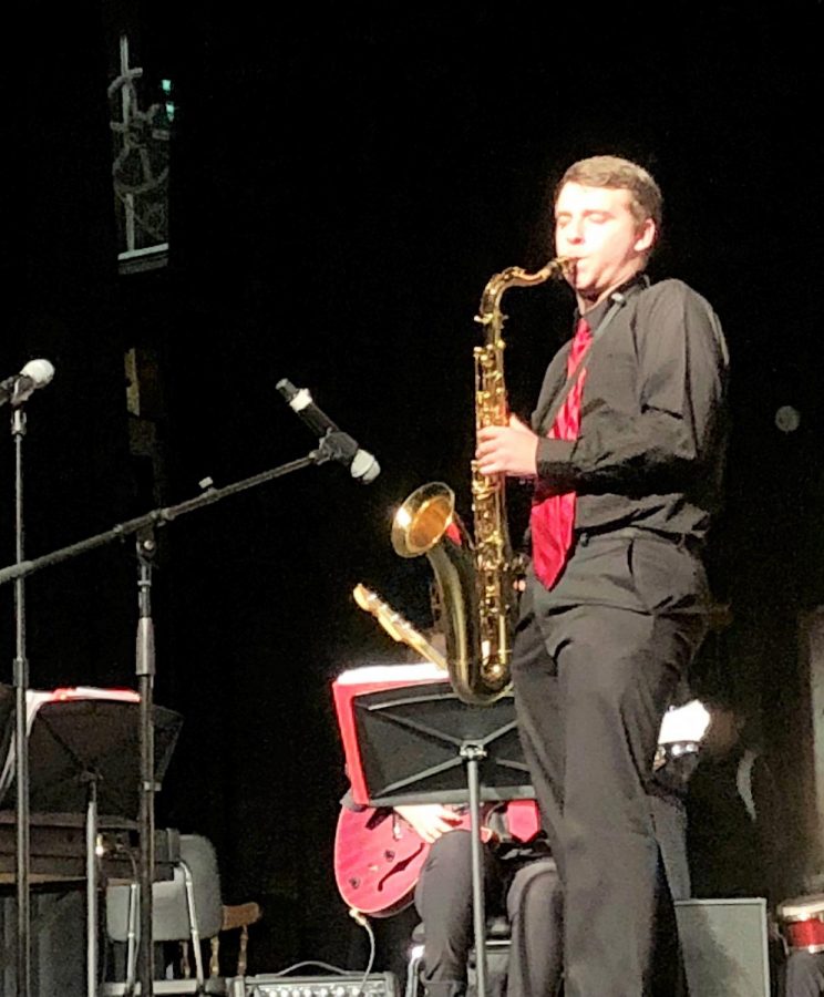 Saxophone Skills: Senior Tim Reynolds performs a solo at the concert.