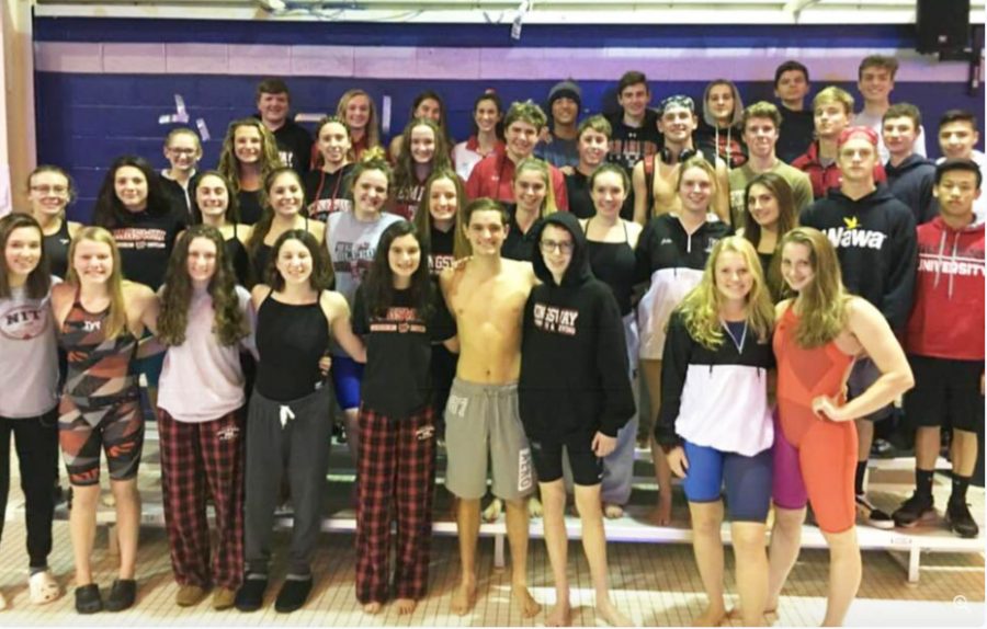 The team paused briefly for a parent picture before their great swims against rival GCIT.
