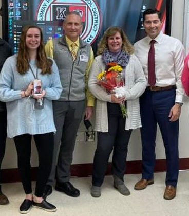 English teacher Sarah Reynolds could not be prouder to share her mother's special moment when math teacher Laura Reynolds was named Teacher of the Year.
L-R  English teacher Sarah Reynolds, Marc Reynolds, Teacher of the Year, Laura Reynolds, Superintendent James Lavender